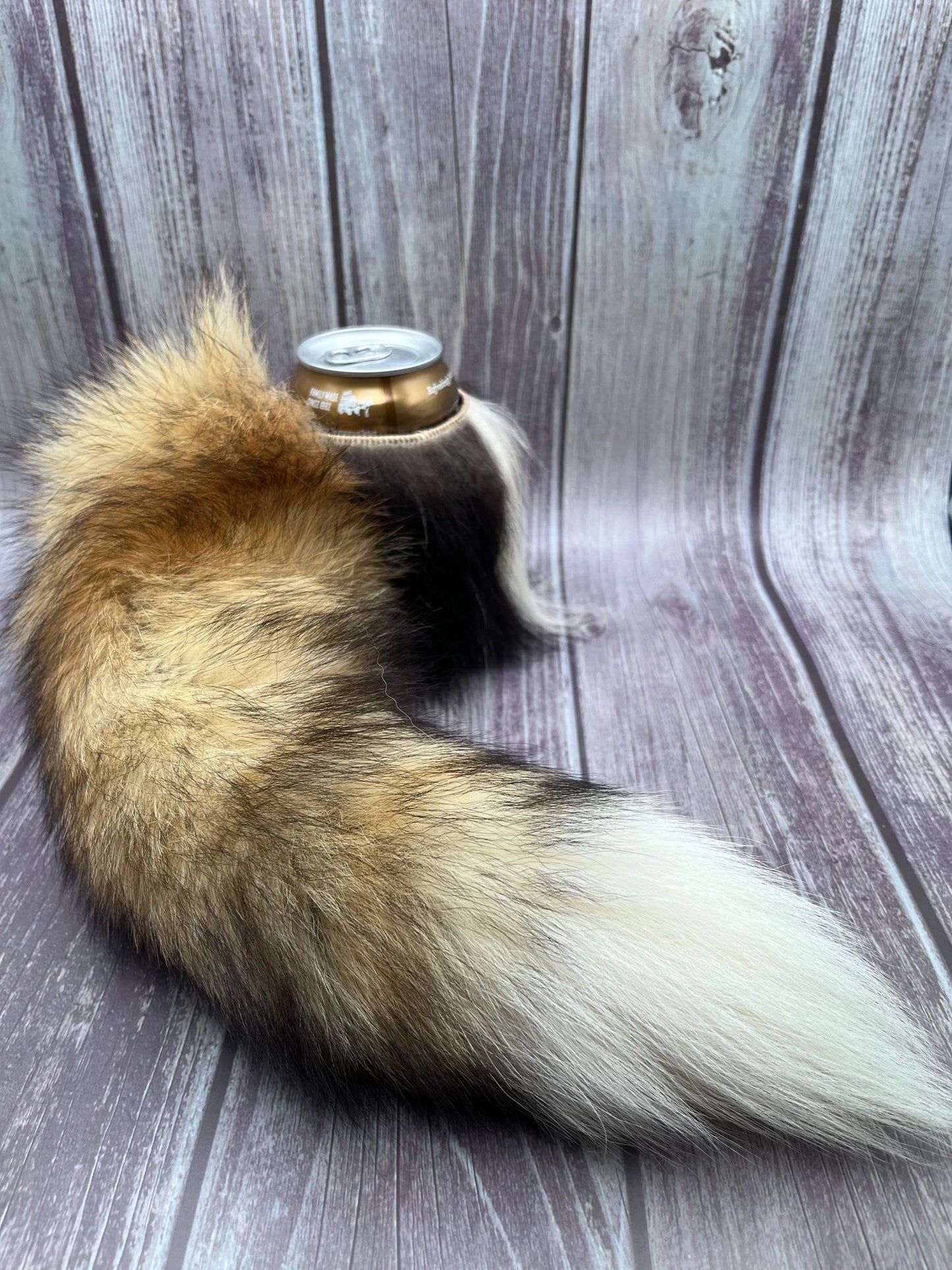 Skunk fur can cooler with Fox tail